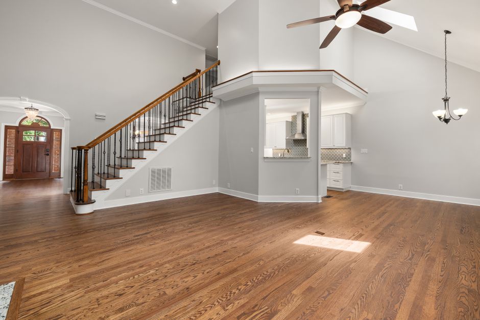 A professionally staged, bright, and modern living room, an example of the high-quality photography essential for a successful digital real estate marketing campaign.